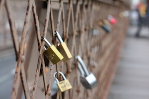 love locks on the brookly bridge are in danger of being removed by authorities
