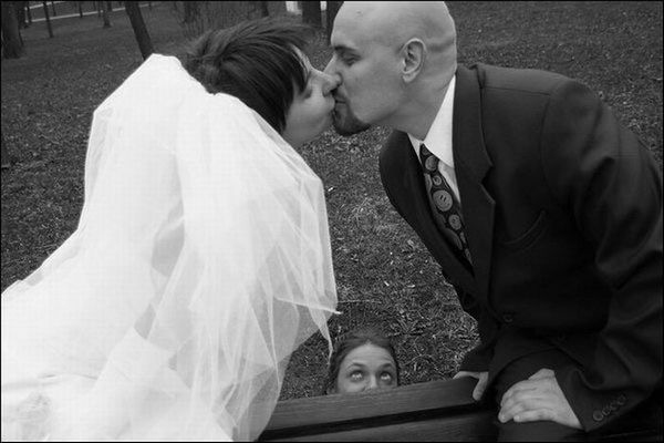 This Celebrant knows NOT to get in the first kiss photo