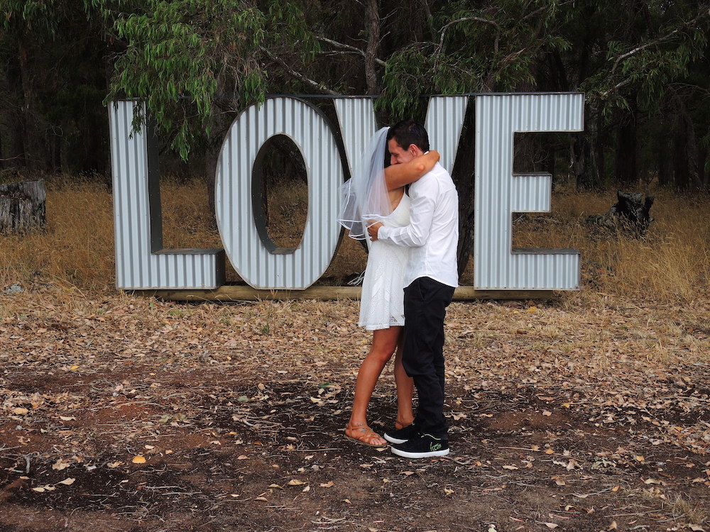 love sign couple hugging