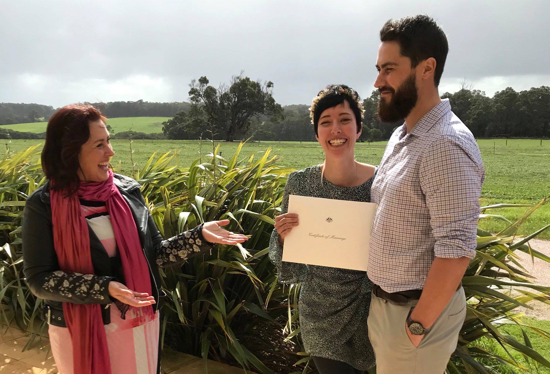 down south celebrant presents marriage certificate to couple eloping in Margaret River