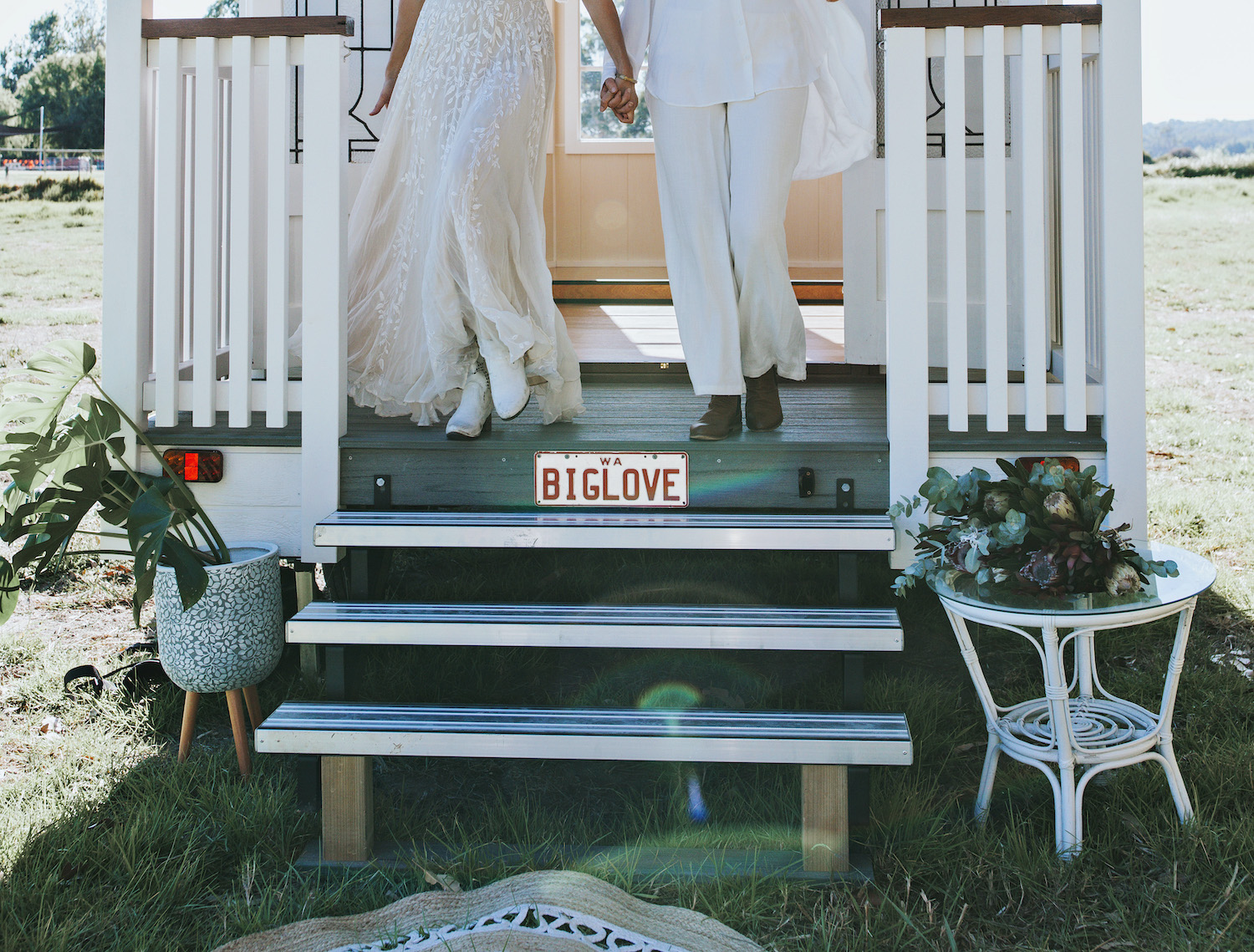 couple standing on porch of big love tiny chapel