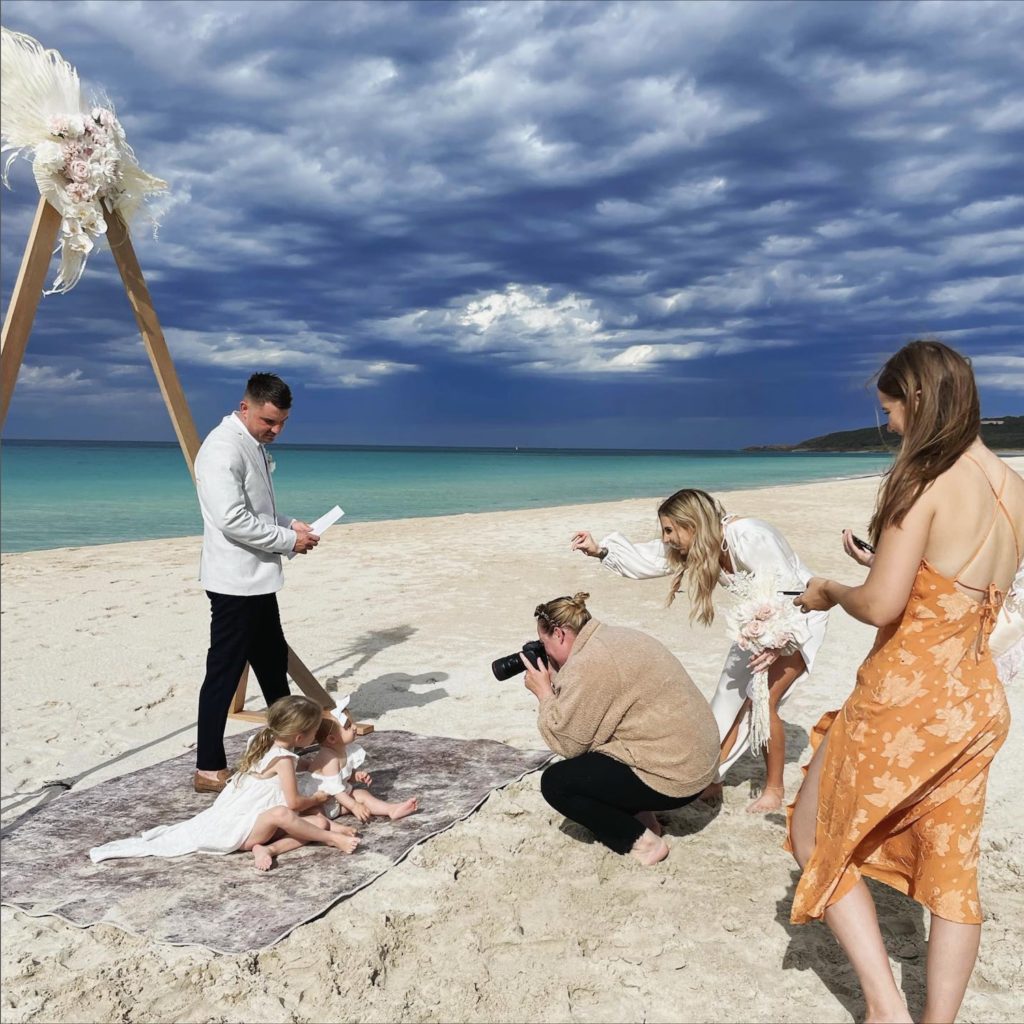 elopement scene on a stormy day on bunker bay beach